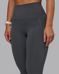 Woman wearing Elixir Ultra High-Rise 7/8 Legging Pockets - Dark Storm | Model:Lyss | Size:S | Thumbnail Index: 6