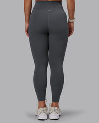Woman wearing Elixir Ultra High-Rise 7/8 Legging Pockets - Dark Storm | Model:Lyss | Size:S | Thumbnail Index: 3