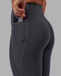 Woman wearing Elixir Ultra High-Rise 7/8 Legging Pockets - Dark Storm | Model:Lyss | Size:S | Thumbnail Index: 2