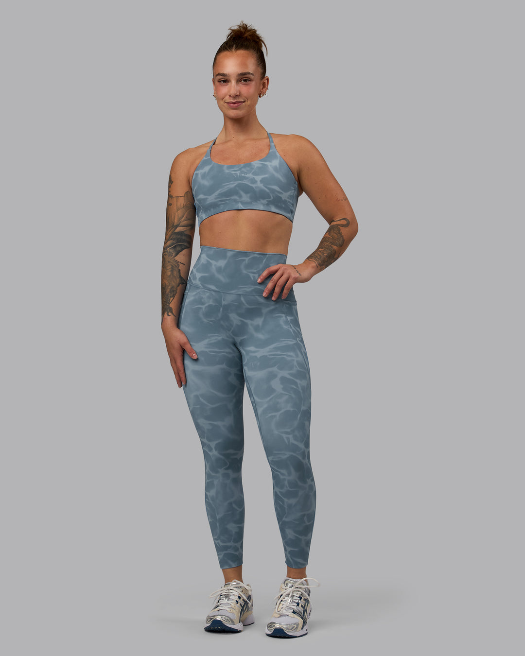 Woman wearing Elixir Ultra High-Rise 7/8 Legging Pockets - Tranquil-Elemental Blue | Model:Robyn | Size:S - view 1