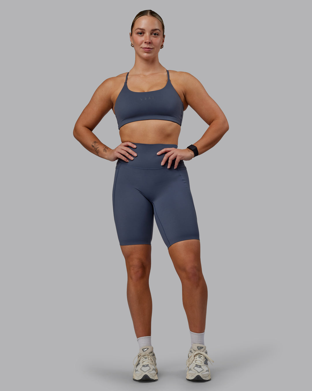 Woman wearing Elixir Ultra High-Rise 9" Short Pockets - Turbulence | Model:Suz | Size:S - view 5