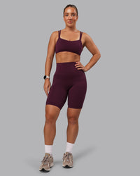 Woman wearing Elixir Ultra High-Rise 9" Short Pockets - Cherry Lacquer | Model:Lyss | Size:S | Thumbnail Index: 0
