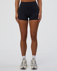 Woman wearing Elixir Defined High-Rise 4" Short Pockets - Black | Model:Bianca | Size:S | Thumbnail Index: 5
