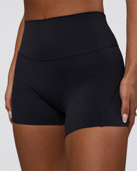 Woman wearing Elixir Defined High-Rise 4" Short Pockets - Black | Model:Bianca | Size:S | Thumbnail Index: 0