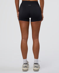 Woman wearing Elixir Defined High-Rise 4" Short Pockets - Black | Model:Bianca | Size:S | Thumbnail Index: 3