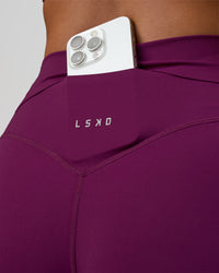 Woman wearing Elixir Defined High-Rise 4" Short - Plum Caspia | Model:Bianca | Size:S | Thumbnail Index: 2