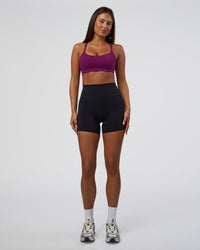 Woman wearing Elixir Defined High-Rise 6" Short Pockets - Black | Model:Bianca | Size:S | Thumbnail Index: 4