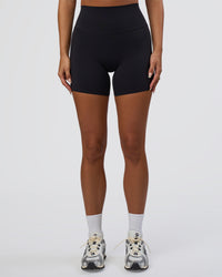 Woman wearing Elixir Defined High-Rise 6" Short Pockets - Black | Model:Bianca | Size:S | Thumbnail Index: 5