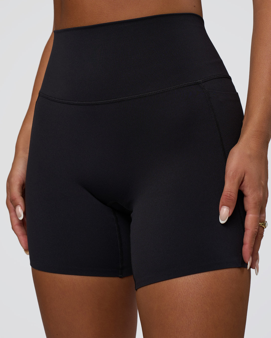 Woman wearing Elixir Defined High-Rise 6" Short Pockets - Black | Model:Bianca | Size:S - view 2