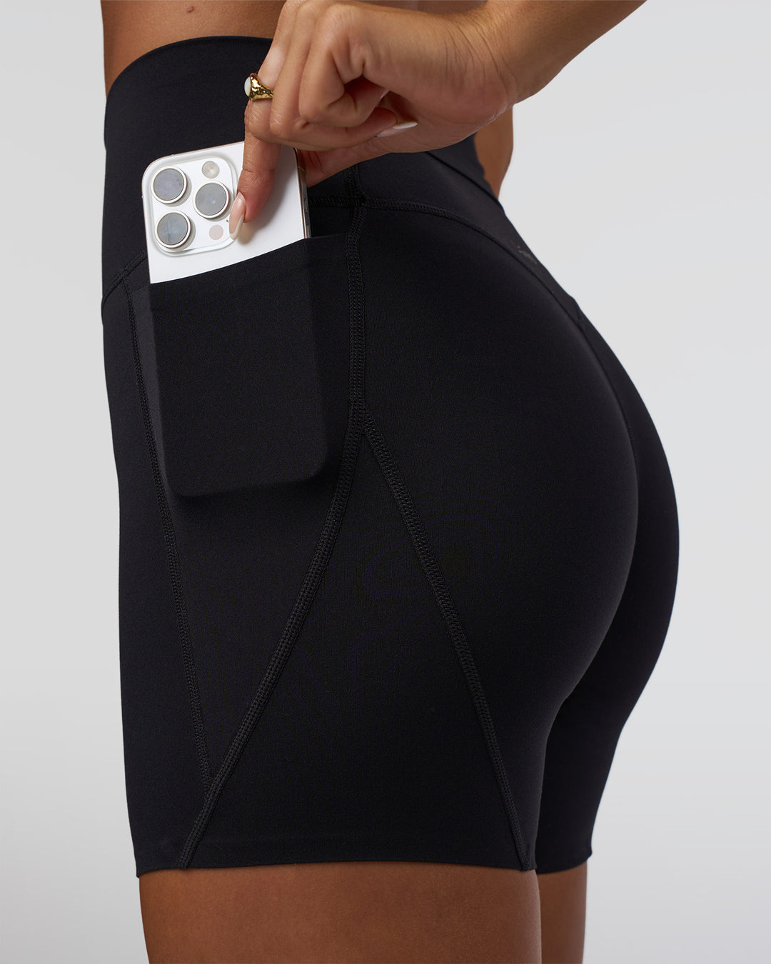 Woman wearing Elixir Defined High-Rise 6" Short Pockets - Black | Model:Bianca | Size:S - view 8