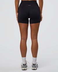 Woman wearing Elixir Defined High-Rise 6" Short Pockets - Black | Model:Bianca | Size:S | Thumbnail Index: 2