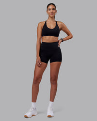 Woman wearing Elixir High-Rise 4" Short - Black | Model:Rhiley | Size:S | Thumbnail Index: 1