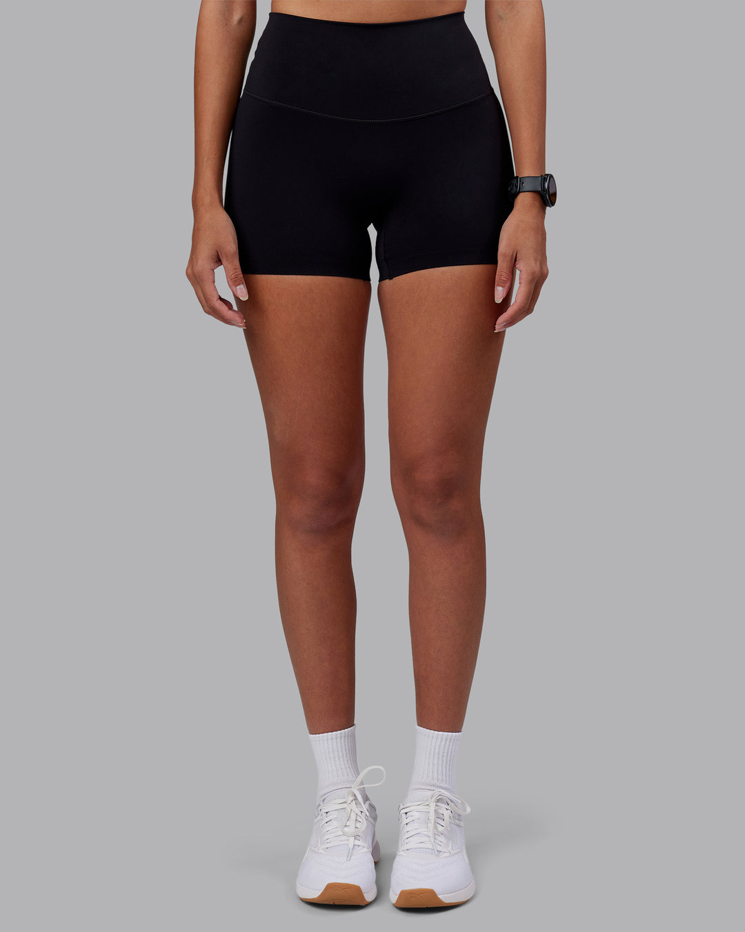 Woman wearing Elixir High-Rise 4" Short - Black | Model:Rhiley | Size:S - view 7
