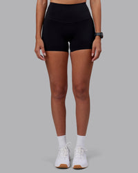 Woman wearing Elixir High-Rise 4" Short - Black | Model:Rhiley | Size:S | Thumbnail Index: 6