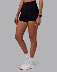 Woman wearing Elixir High-Rise 4" Short - Black | Model:Rhiley | Size:S | Thumbnail Index: 2