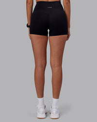 Woman wearing Elixir High-Rise 4" Short - Black | Model:Rhiley | Size:S | Thumbnail Index: 3