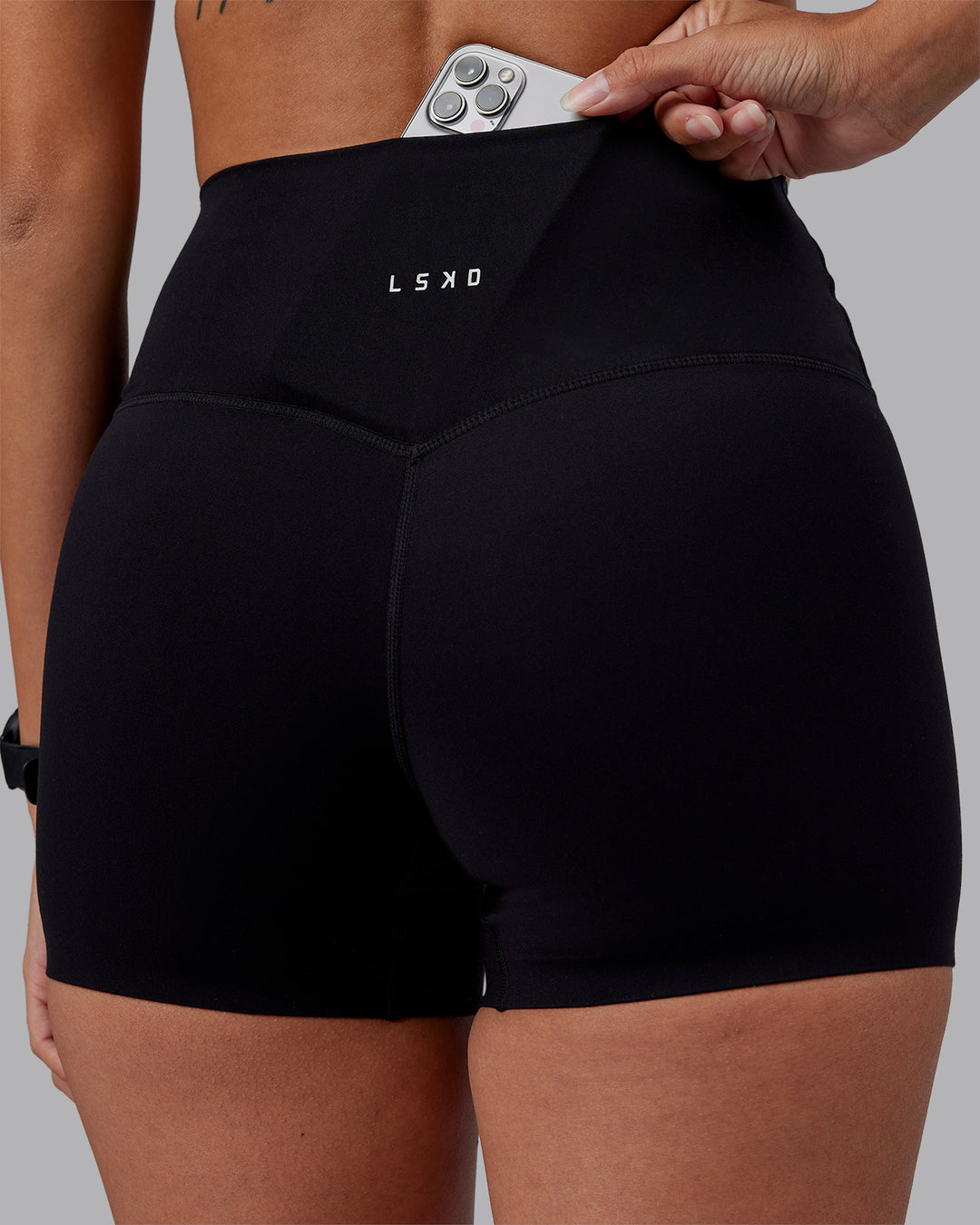 Woman wearing Elixir High-Rise 4" Short - Black | Model:Rhiley | Size:S - view 6