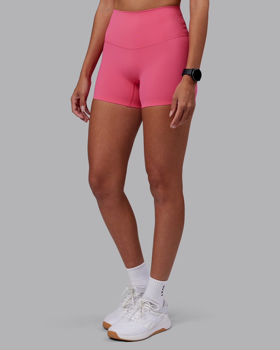 Woman wearing Elixir High-Rise 4" Short - Hot Pink | Model:Rhiley | Size:S - view 6