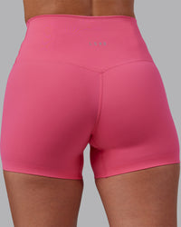 Woman wearing Elixir High-Rise 4" Short - Hot Pink | Model:Rhiley | Size:S | Thumbnail Index: 6