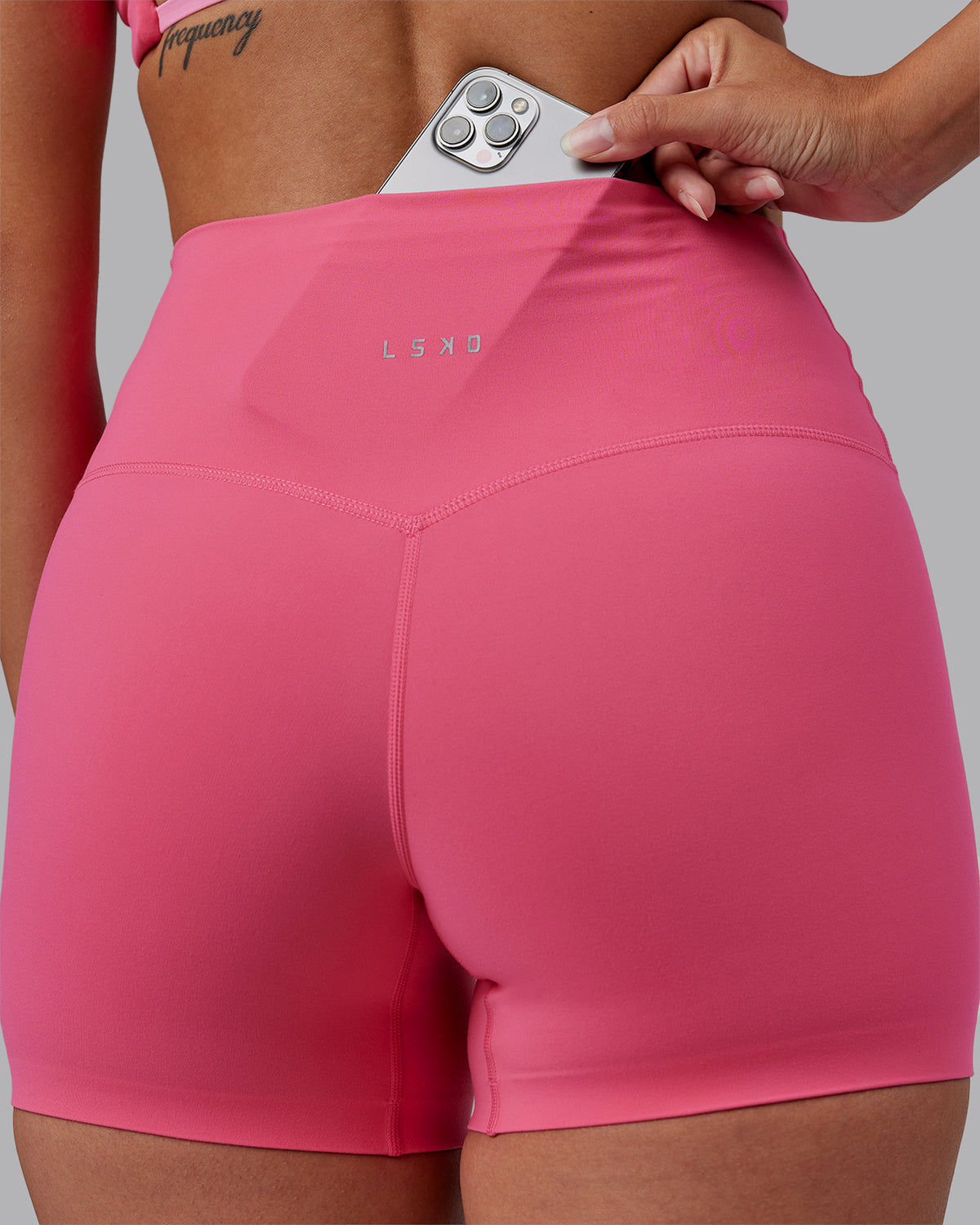 Woman wearing Elixir High-Rise 4" Short - Hot Pink | Model:Rhiley | Size:S