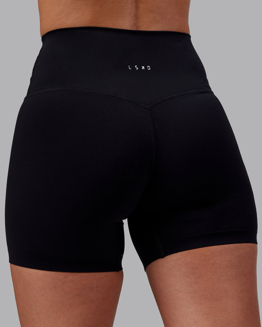 Woman wearing Elixir High-Rise 6" Short - Black | Model:Rhiley | Size:S - view 8
