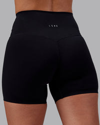 Woman wearing Elixir High-Rise 6" Short - Black | Model:Rhiley | Size:S | Thumbnail Index: 7