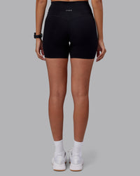 Woman wearing Elixir High-Rise 6" Short - Black | Model:Rhiley | Size:S | Thumbnail Index: 3