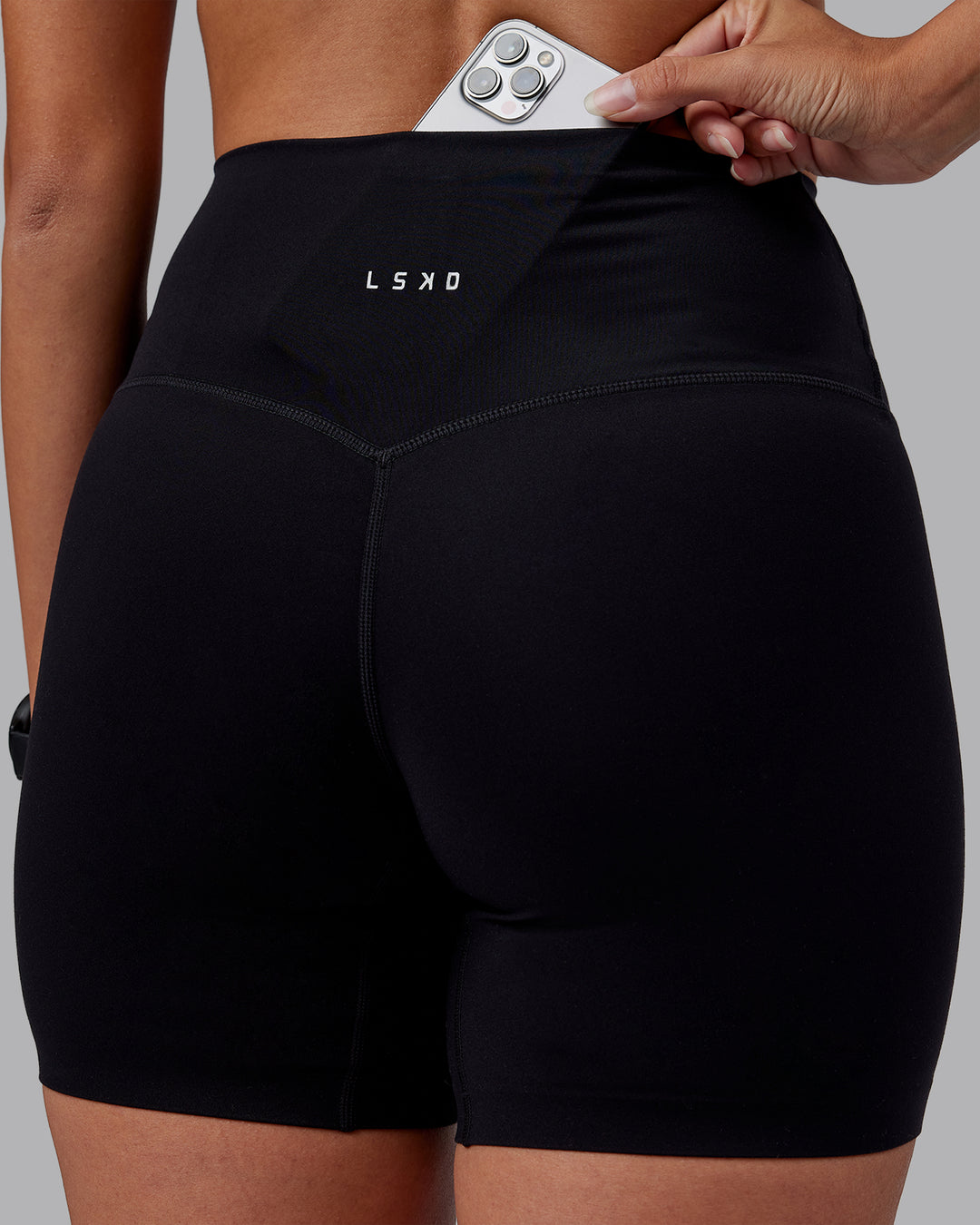 Woman wearing Elixir High-Rise 6" Short - Black | Model:Rhiley | Size:S - view 2