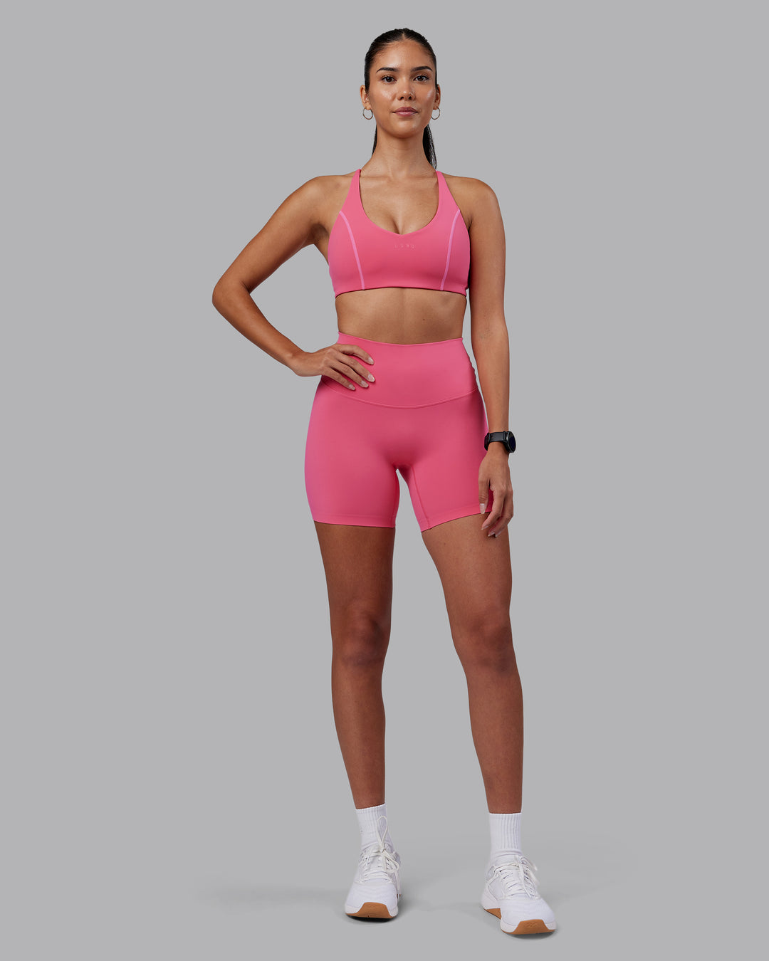 Woman wearing Elixir High-Rise 6" Short - Hot Pink | Model:Rhiley | Size:S - view 3
