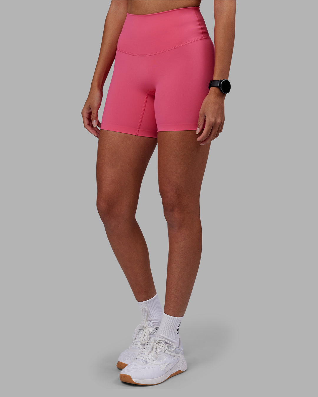 Woman wearing Elixir High-Rise 6" Short - Hot Pink | Model:Rhiley | Size:S - view 1