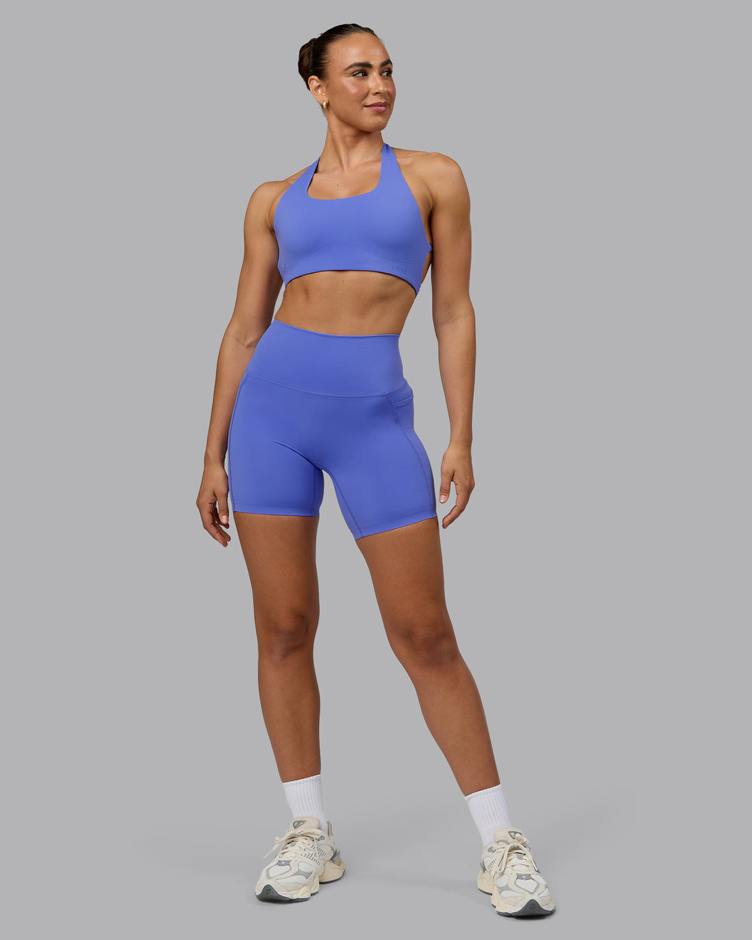 Woman wearing Elixir Ultra High-Rise 6" Short Pockets - Baja Blue - view 2