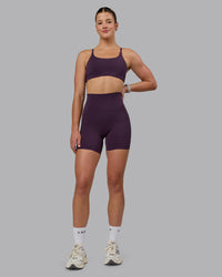 Woman wearing Elixir Ultra High-Rise 6" Short Pockets - Midnight Plum | Thumbnail Index: 4