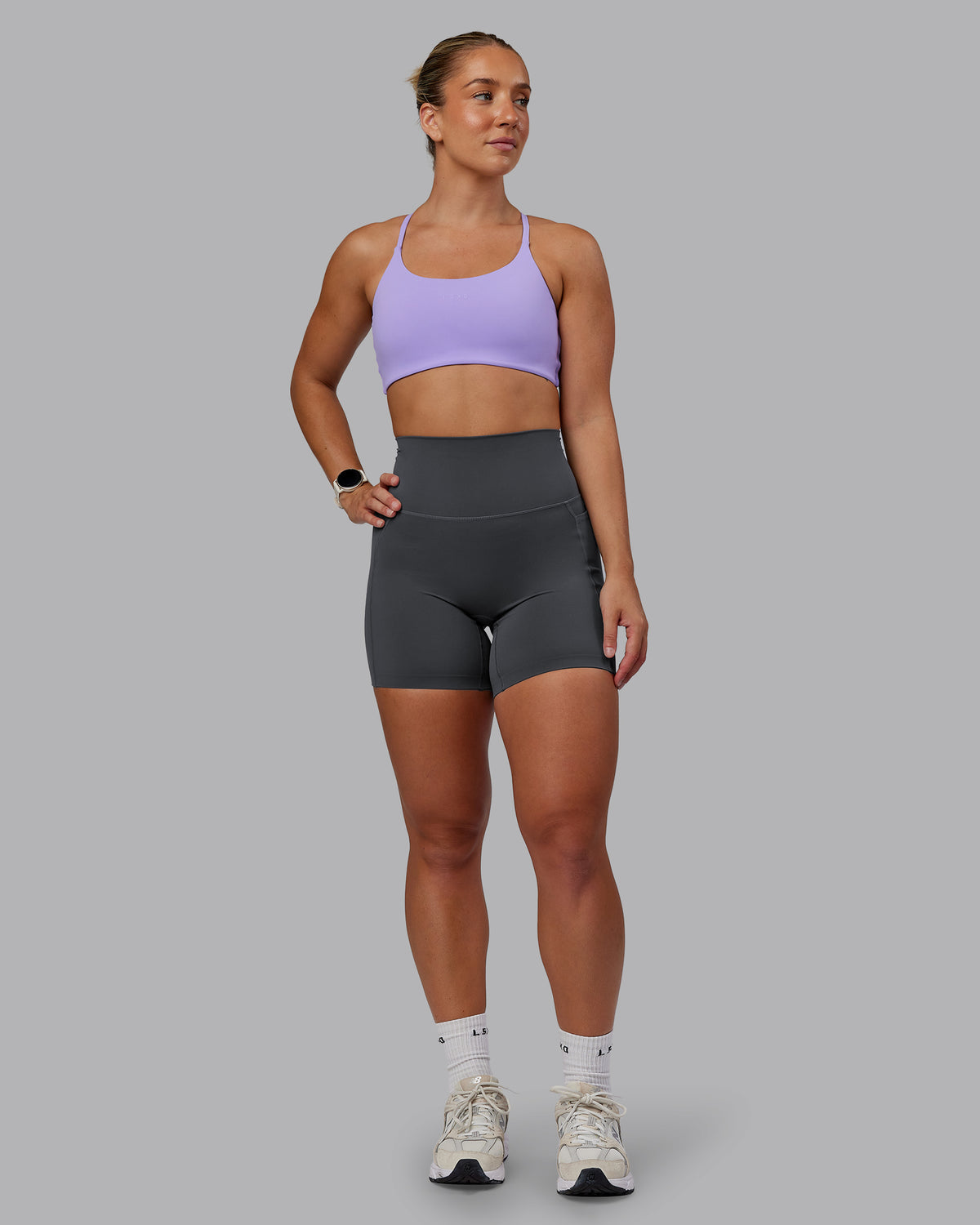 Woman wearing Elixir Ultra High-Rise 6" Short Pockets - Dark Storm | Size:S