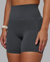 Woman wearing Elixir Ultra High-Rise 6" Short Pockets - Dark Storm | Size:S | Thumbnail Index: 5
