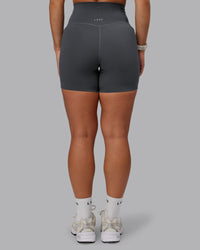 Woman wearing Elixir Ultra High-Rise 6" Short Pockets - Dark Storm | Size:S | Thumbnail Index: 3
