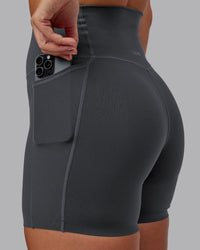 Woman wearing Elixir Ultra High-Rise 6" Short Pockets - Dark Storm | Size:S | Thumbnail Index: 0