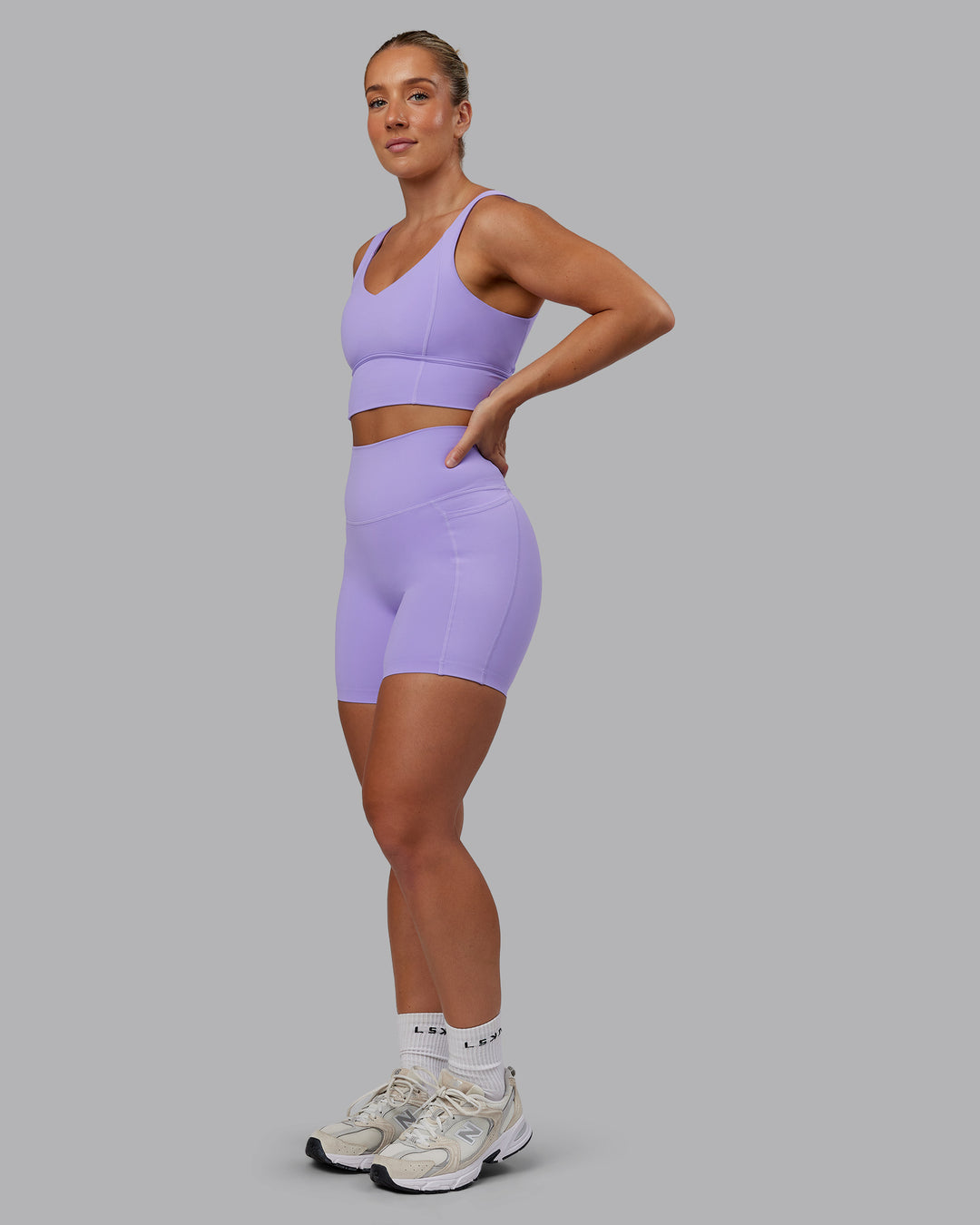 Woman wearing Elixir Ultra High-Rise 6" Short Pockets - Violet Ray | Size:S - view 6