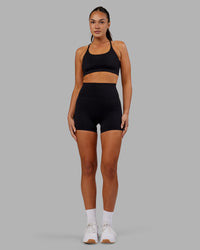 Woman wearing Elixir Ultra High-Rise 4" Short - Black | Model:Kirstyn | Size:S | Thumbnail Index: 4