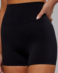 Woman wearing Elixir Ultra High-Rise 4" Short - Black | Model:Kirstyn | Size:S | Thumbnail Index: 2