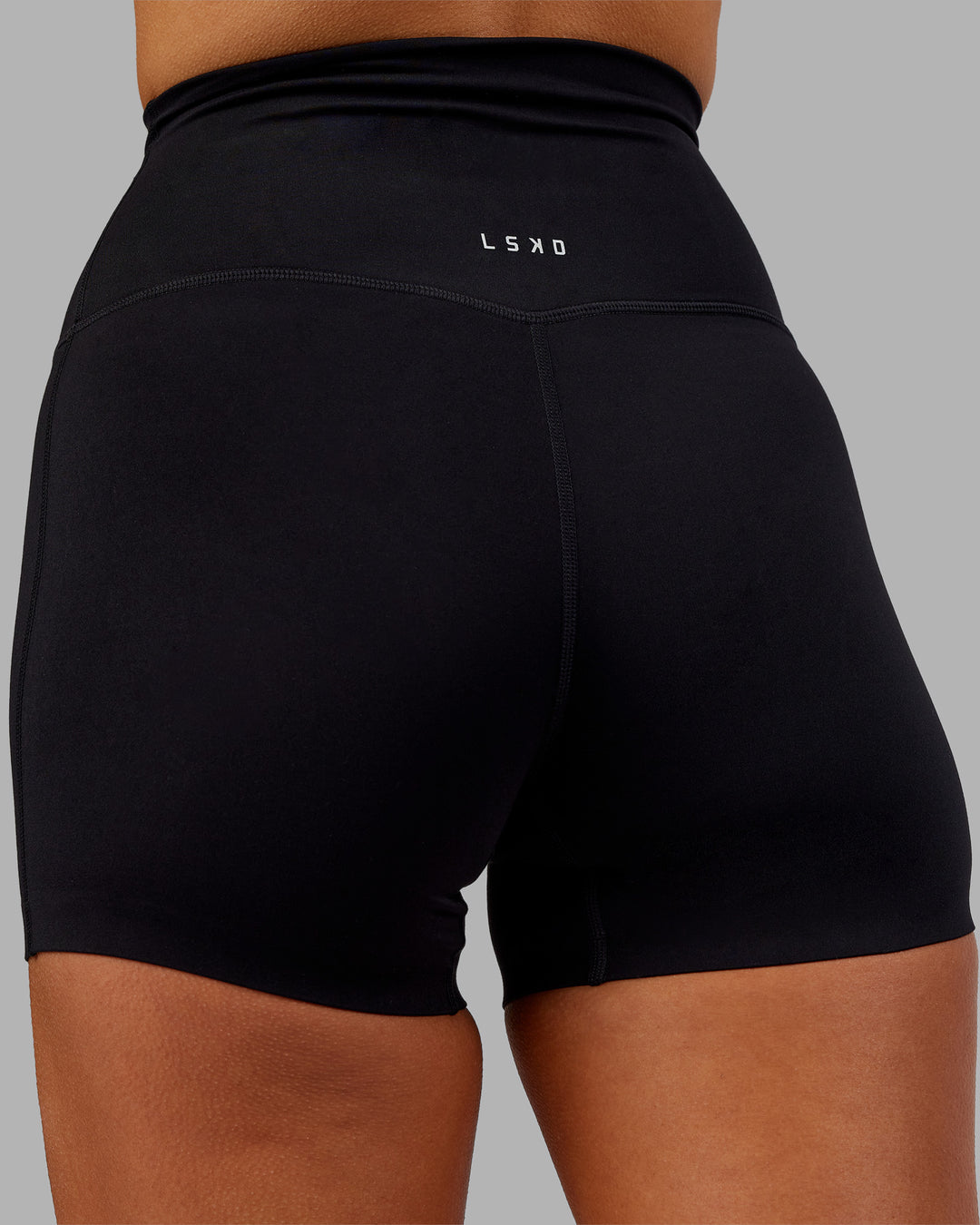 Woman wearing Elixir Ultra High-Rise 4" Short - Black | Model:Kirstyn | Size:S - view 8