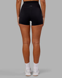 Woman wearing Elixir Ultra High-Rise 4" Short - Black | Model:Kirstyn | Size:S | Thumbnail Index: 3