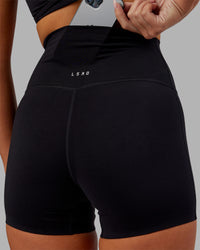 Woman wearing Elixir Ultra High-Rise 4" Short - Black | Model:Kirstyn | Size:S | Thumbnail Index: 5