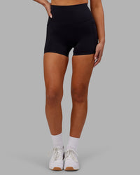 Woman wearing Elixir Ultra High-Rise 4" Short Pockets - Black | Model:Kirstyn | Size:S | Thumbnail Index: 5