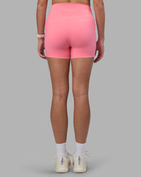Woman wearing Elixir Ultra High-Rise 4" Short Pockets - Candy Pink | Model:Phoebe | Size:S | Thumbnail Index: 3