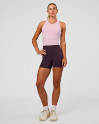 Woman wearing Elixir Ultra High-Rise 4" Short Pockets - Midnight Plum | Model:Emelia | Size:S | Thumbnail Index: 2