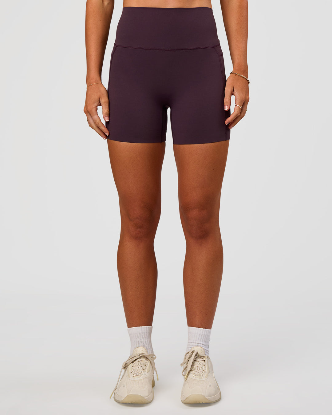 Woman wearing Elixir Ultra High-Rise 4" Short Pockets - Midnight Plum | Model:Emelia | Size:S - view 2