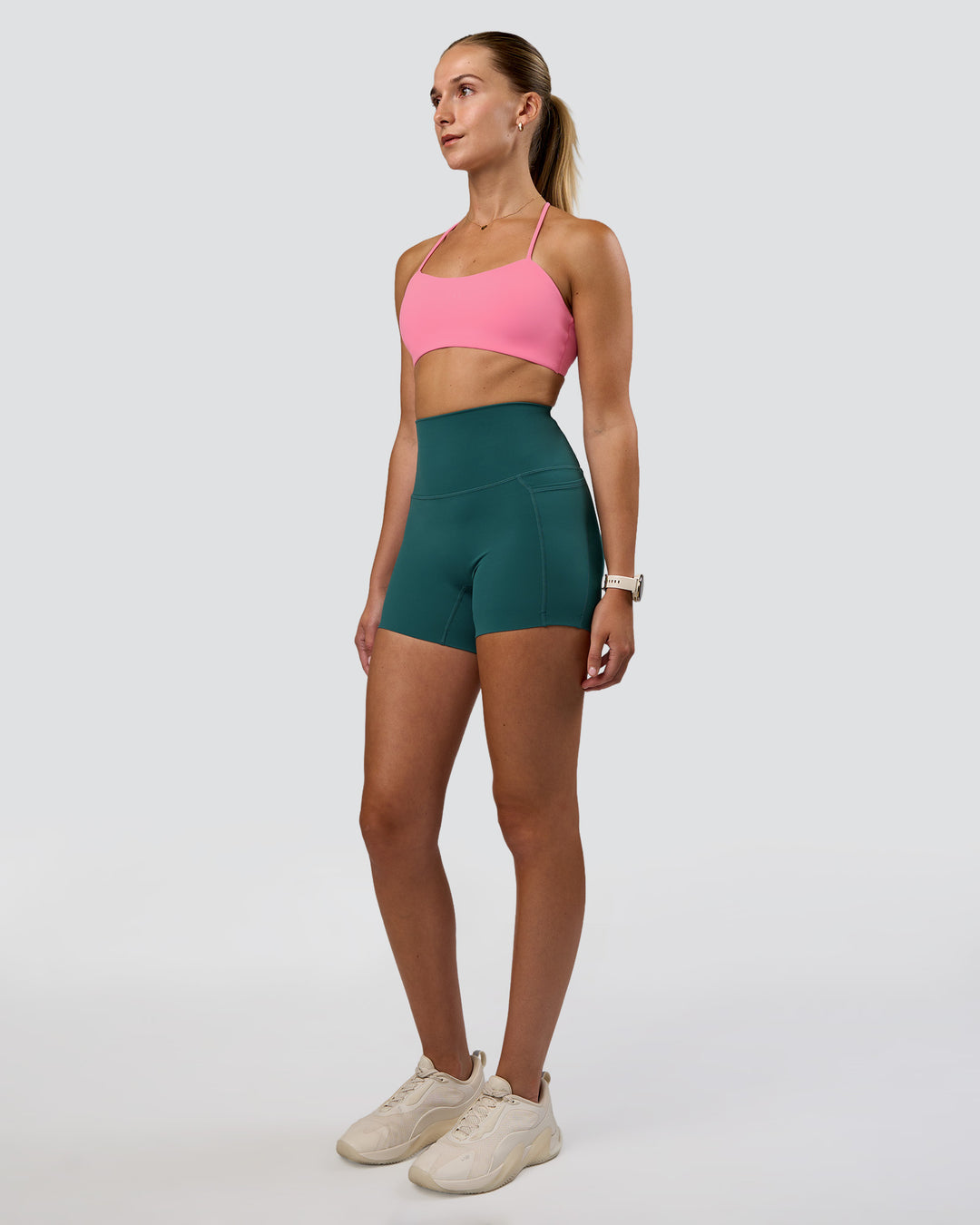 Woman wearing Elixir Ultra High-Rise 4" Short Pockets - Transformative Teal | Model:Myrte | Size:S - view 2