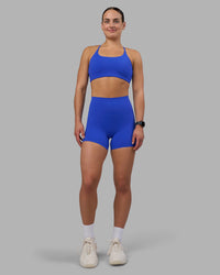 Woman wearing Elixir Ultra High-Rise 4" Short - Power Cobalt | Model:Keisha | Size:S | Thumbnail Index: 1