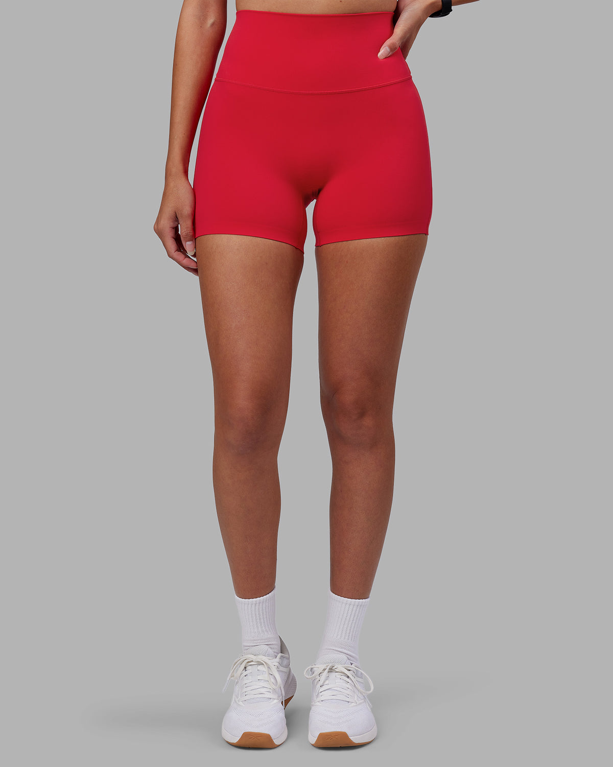 Woman wearing Elixir Ultra High-Rise 4" Short - Scarlet | Model:Rhiley | Size:S