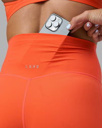 Woman wearing Elixir Ultra High-Rise 4" Short - Ultra Orange | Model:Katie | Size:S | Thumbnail Index: 2